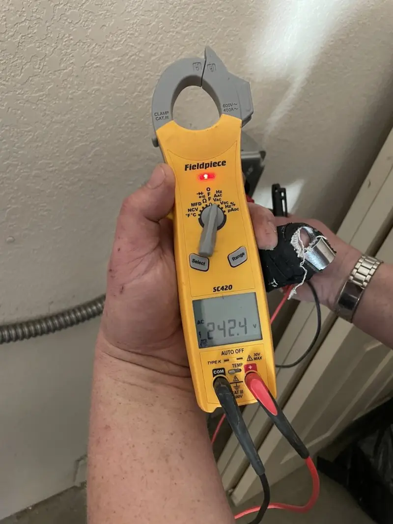 Voltage testing with clamp meter during Hot Tub / Pool Electrical Wiring in Celina